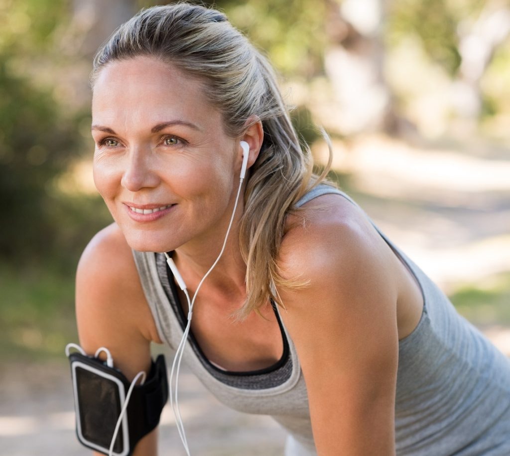 Woman exercising and smiling