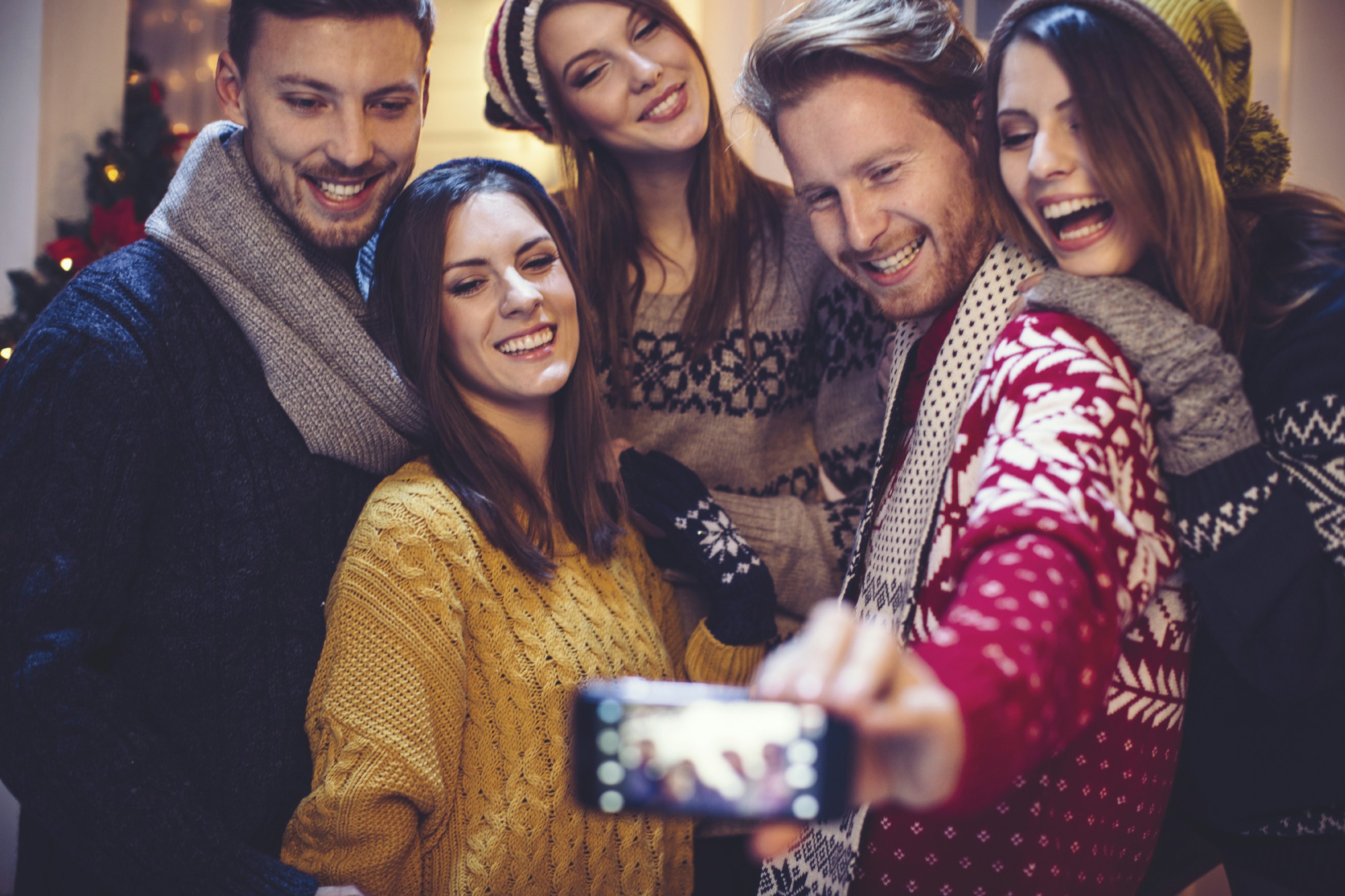 People celebrating Christmas taking a selfie