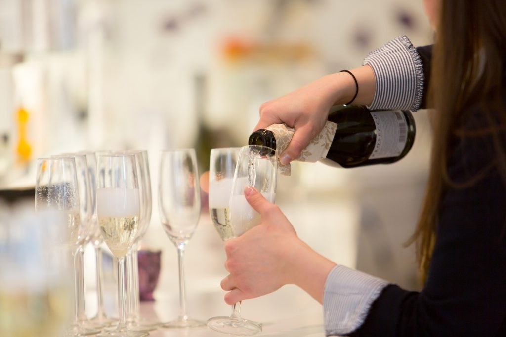 Woman pouring prosecco